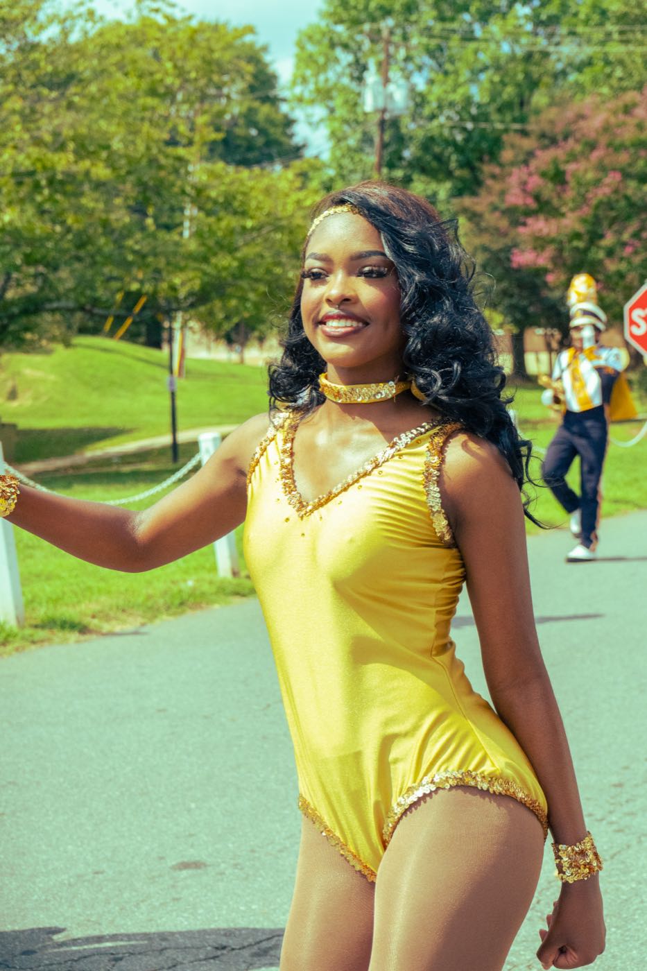 A Blue Satin dancer waving to the crowd